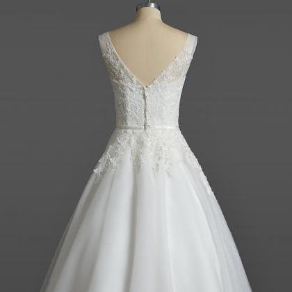 Ivory Short Tulle Wedding Gown Featuring Lace..